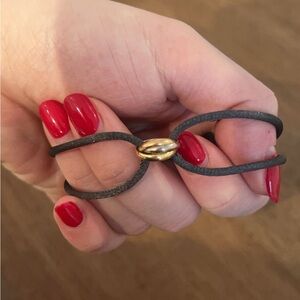 Pre-Owned Cartier Trinity On Cord Bracelet in 18K Gold. Condition: Very Good